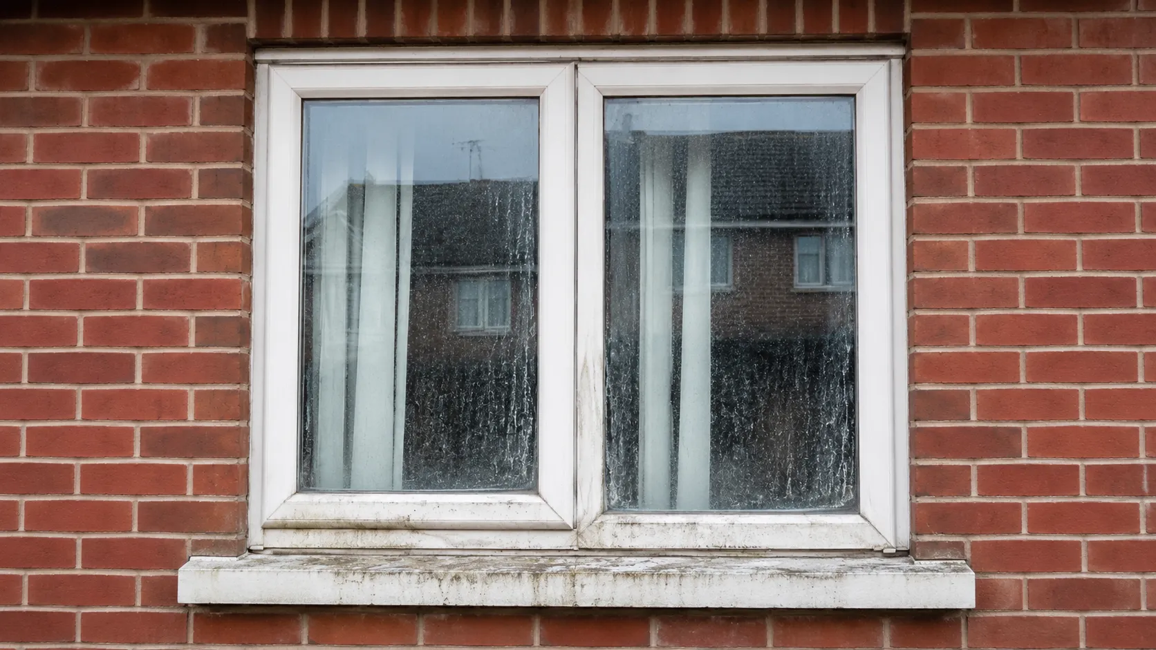 Window before exterior cleaning